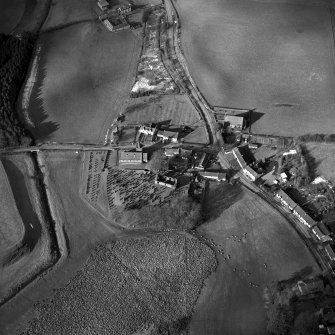 Dalton, oblique aerial view, taken from the SE, centred on the old parish church and the parish church. A road bridge is visible in the centre left-hand side of the photograph.