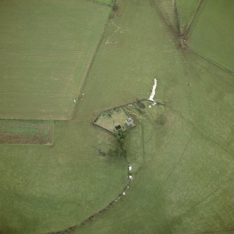 Repentance Tower, oblique aerial view, taken from the NE, centred on the tower and Trailtrow chapel and burial-ground.
