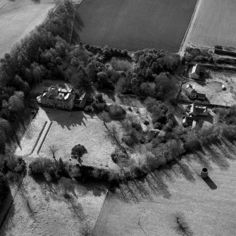 Wallhouse, oblique aerial view, taken from the NE, centred on the country house. A dovecot is visible in the bottom right-hand corner of the photograph.