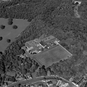 Dalkeith, Lugton Brae, oblique aerial view, taken from the SW, centred on school buildings. Montagu Bridge is visible in the top right-hand corner of the photograph.
