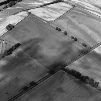 Mertoun Bridge, obique aerial view, taken from the SW, centred on the cropmarks of a Roman Temporary Camp.