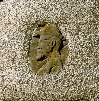 Leith Hall, exterior.  East entrance block: detail of carved head on turret at North East corner