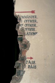 Detail of painted notice on first floor landing.