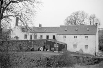 View from NE showing ENE front of mill with millers house in background