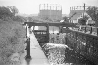 View from NW showing WNW front of E lock gates with gasholders and lock-keeper's cottage in background