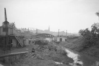 View looking SE showing part of Gartsherrie Hornock and Summerlee Branch Canal with railway bridge in background