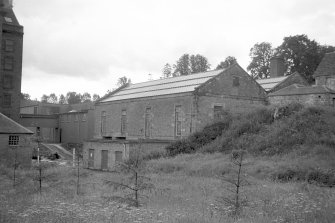 View from N showing NE front and part of NW front of waterwheel house/power station