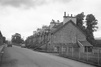 View from SSE showing SW and SE fronts of houses on N side of Teith Road