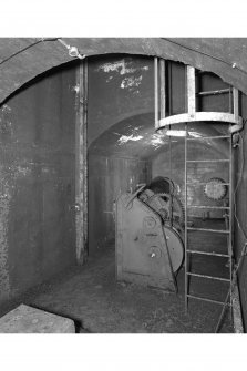 Tank access tunnel, detail of float gauge, winch and access ladder.