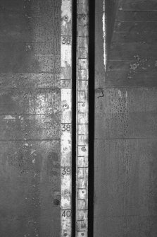 Tank access tunnel, detail of float gauge scale.