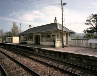 View of Glenfinnan Railway Station from north of main station building, containing former booking office and now the Glenfinnan Railway Museum.