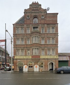 View from E of E elevation of block at 42 Bain Street (also showing 1877 date plaque in gable)