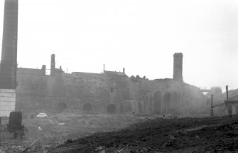 General view from SW showing SSW and SSE fronts of furnace bank with hot-blast tower and ironstone calcining kiln in background