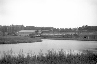 View from SE showing basin with ironworks and tenements in background