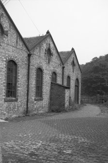 View from SW showing part of SSE front of main blocks