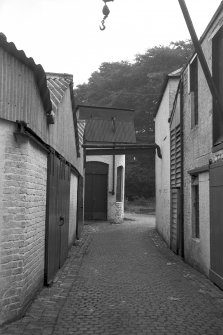 View looking E along road between main blocks and central block