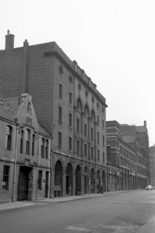 View from S showing ESE front of store with Globe Tubes Works in foreground and foundry and engine works in background