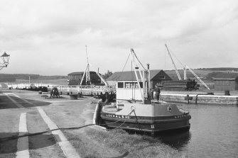 View from SSE showing workboat at N end of Muirtown Basin with crab winch and workshops in background