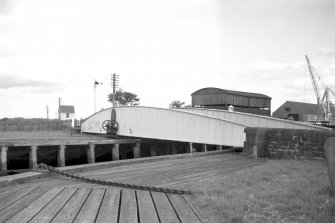View from W showing NNW front of swing bridge with workshops in background