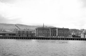 View from NE showing NE front of Custom House with Steamboat Quay in foreground