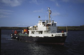 Scanned image of Canna harbour. Arrival of Lochmor ferry.