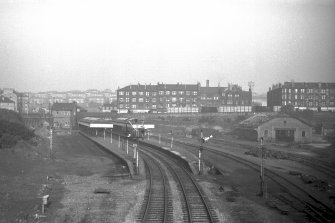 General view from WSW showing station with tenements and Soldiers Home in background and goods shed on right