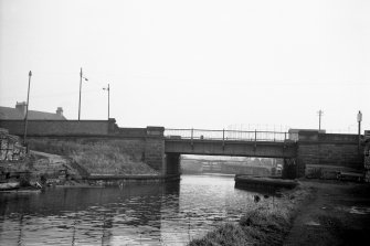 View from NW showing NW front of bridge with locks in background