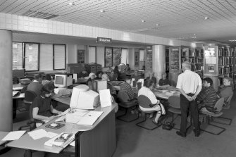 Interior view of the NMRS library, with Mr David Easton giving a talk to the Edinburgh University International Archaeology Summer School.