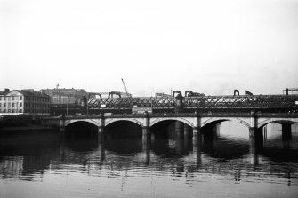 View from E showing part of ESE front of Glasgow Bridge with railway bridge in background
