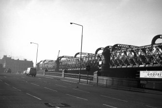 View looking SW showing deck of Glasgow Bridge with railway bridge in background
