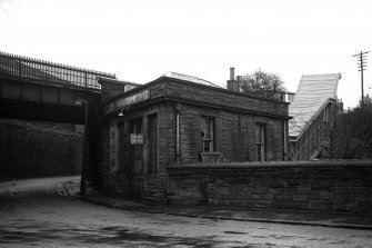 View from NE showing ESE front and part of NNE front of booking office with part of bridge in background