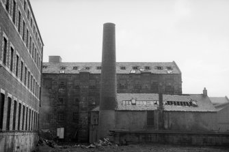 View from WNW showing WNW front of engine house with mill in background and part of horse-tram depot on left