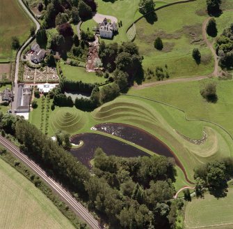 Oblique aerial view of house and garden.