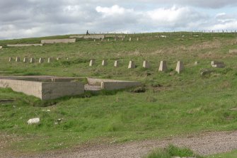 Scanned image of view of hut bases from South-West