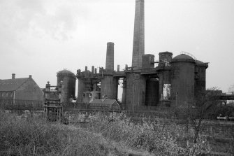 View from ESE showing part of railway viaduct with blast furnaces in background