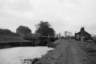 View from ENE showing ESE front of lock with cottage on right and bothy and hostelry in background