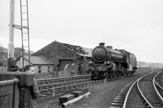 View from NE showing locomotive passing goods shed