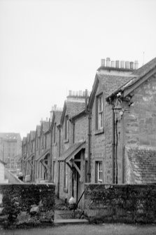 View from NNW showing NE front of houses on N side of Teith Road