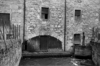 View from W showing sluice and WSW front of arch of wheelhouse of lower city mills