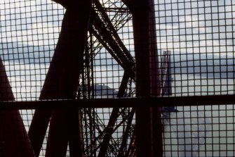 Forth Bridge:  View from west side of Fife Cantilever inside elevator cage with the safety door shut, being taken to the top of the bridge