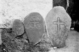 View of cross-incised stones.
Original negative captioned: 'Ancient Stone Crosses at Old Church of Dyce May 1903'.