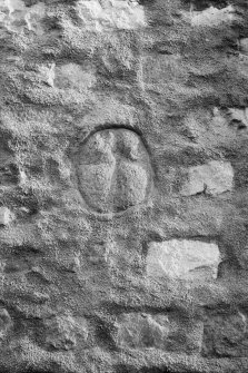 Incised cross built into wall.
Original negative captioned: 'Cross in North Wall of Freemasons Hall, Inverurie (19in x 16in) 1909 / Cross 19 inches long 16 inches broad'.

