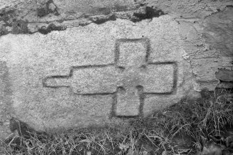 Photograph of cross-incised stone built into base of wall.
Glass half-plate negative.