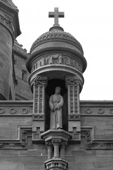 Detail of statue in niche on E facade.