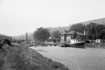 View from SE showing boats with lock and lock-keeper's cottages in background