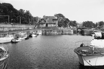 View from W showing basin with lock and lock-keeper's cottages in background