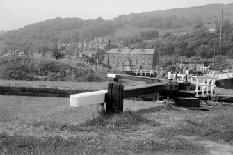 View from SE showing top of E lock gates with tenements in background