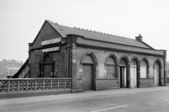 View from ESE showing ENE front and part of S front of booking office