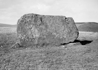 View of recumbent stone. The stone on which it rests (to the right) has four cup marks, though these are only visible on AB 2966.
Original glass negative captioned 'Braehead, Leslie near Insch Recumbent Stone view from front 1908'.