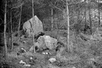 General view showing stones and ditch.
Print card captioned: "Possibly a Class 1 Henge."
Original glass negative captioned 'Remains of Stone Circle at Hill of Tuack, Kintore April 1919'.